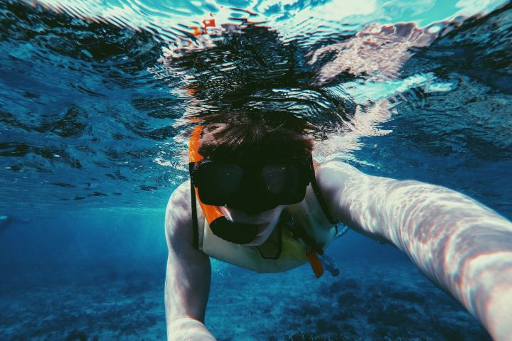 Man snorkeling in the ocean.